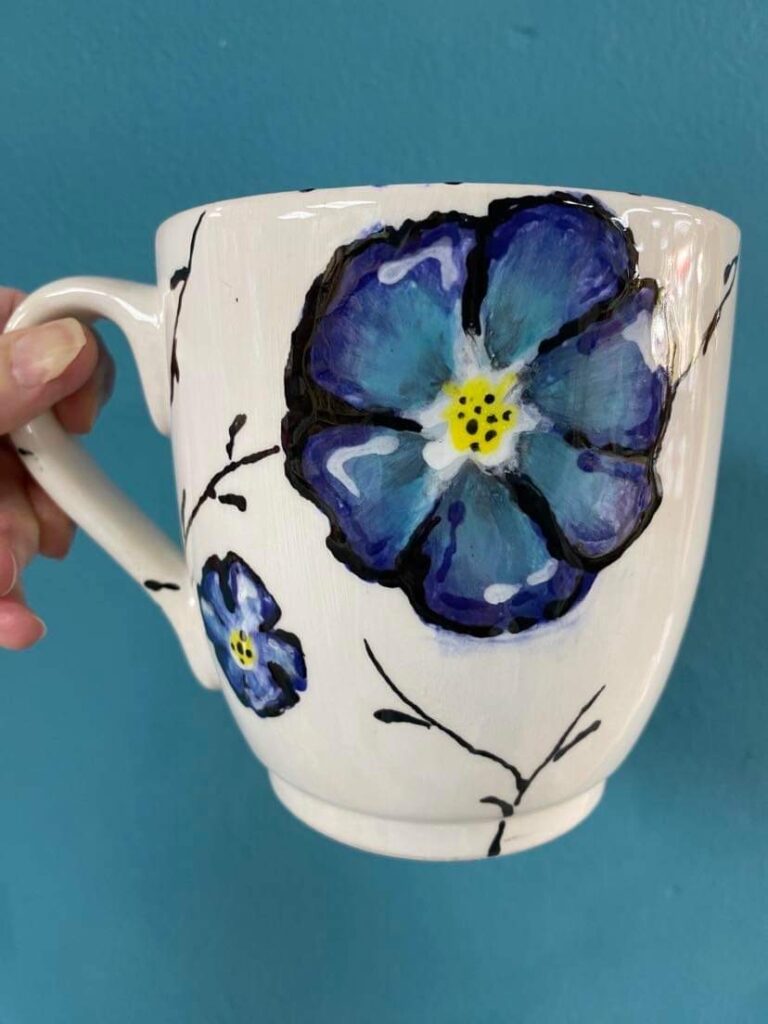 Painted mug with blue flowers 